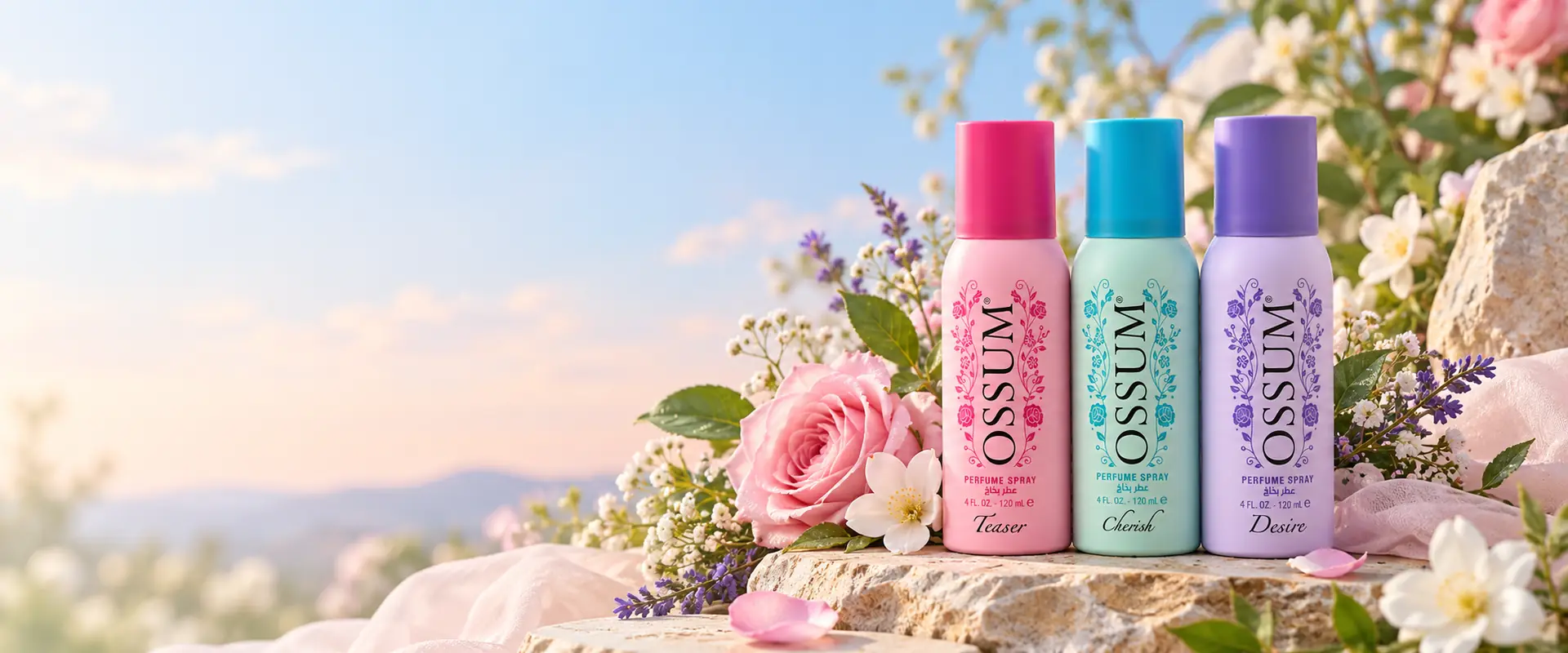 Les flacons OSSUM TEASER, CHERISH et DESIRE entourés de fleurs, au coucher du soleil.